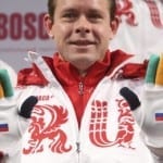 Former Russian ice-hockey player Bure shows a pair of gloves during a presentation of Russia’s uniform for the Sochi 2014 Winter Olympics in Moscow