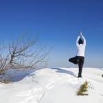 Winter yoga session in beautiful mountain place