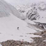 15 Ant skiing past snout of Zamok Glacier