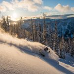 Skiing through powder at Whitewater Ski Resort