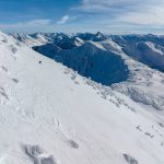 Skier riding down a side-country trail at Mount Mackenzie, Revelstoke.