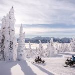 Snowmobiling from the door at Glacier House Resort.