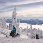 Snowmobiling from the door at Glacier House Resort.