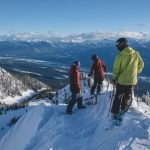 A trio of skiers on the mountain at Kicking Horse Mountain Resort.