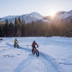 Two people snow biking at Nipika Mountain Resort.