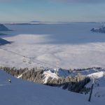 View over the Grand Massif ski area towards Le Mole and a cloud-covered Arve Valley.