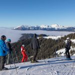 Grand Massif skiers above a cloud-covered Arve Valley.