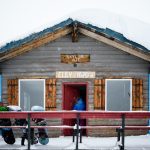 Snowboarders entering cabins at Hudson Bay Mountain Resort, Smithers BC